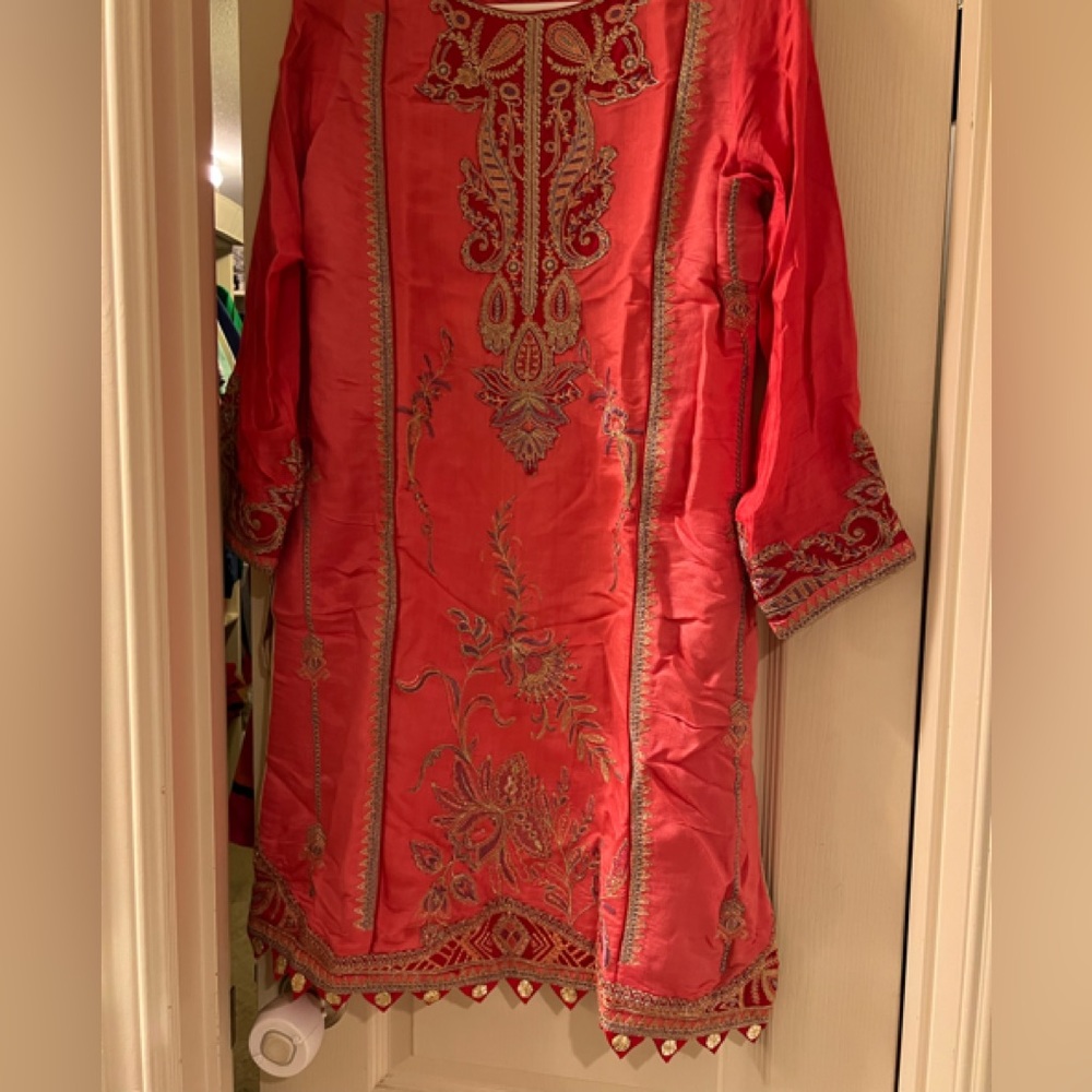 Beautiful embroidered dress with organza duppta and block paint shararah..